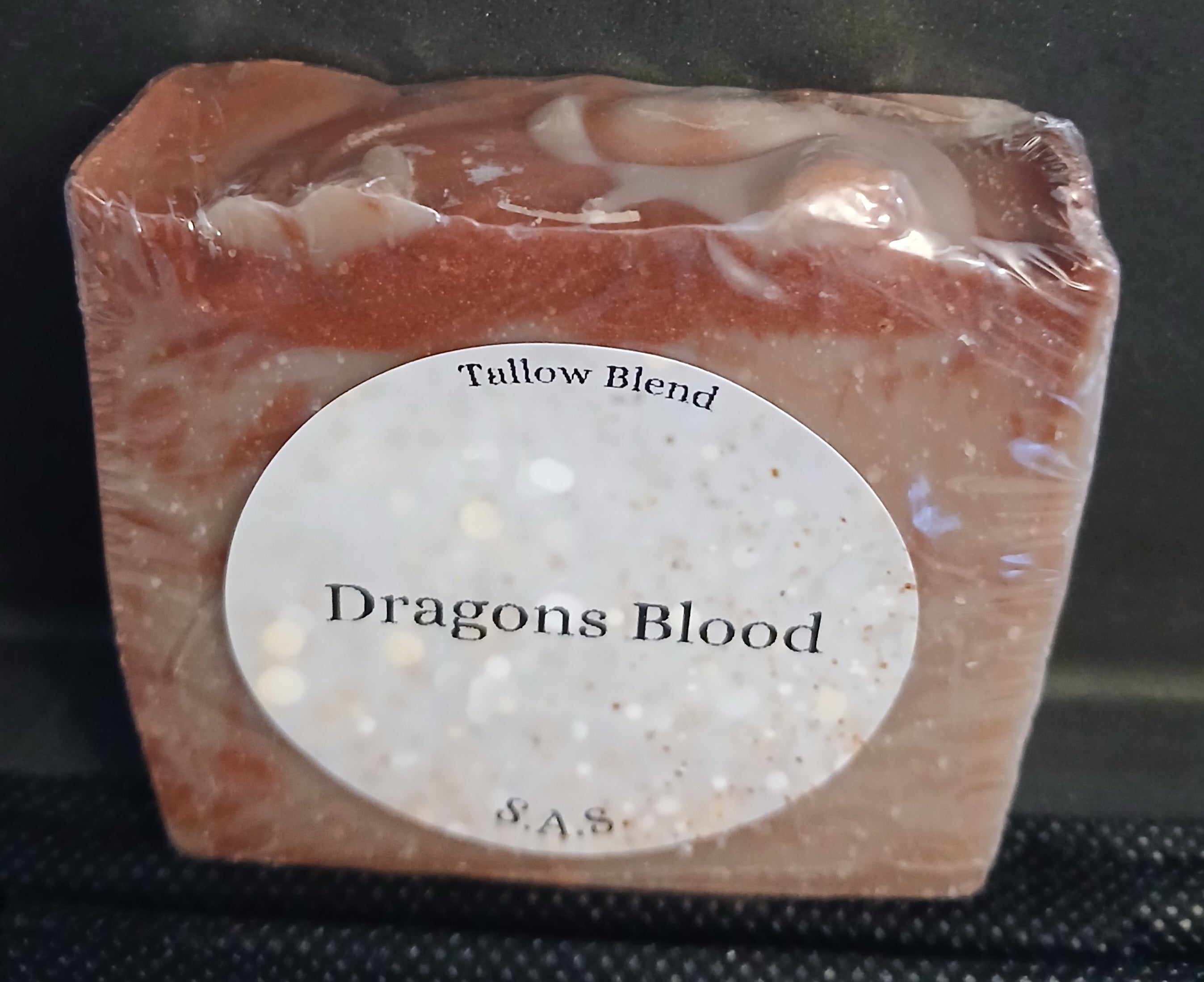Dragons Blood tallow blend soap bar with deep red and white swirls