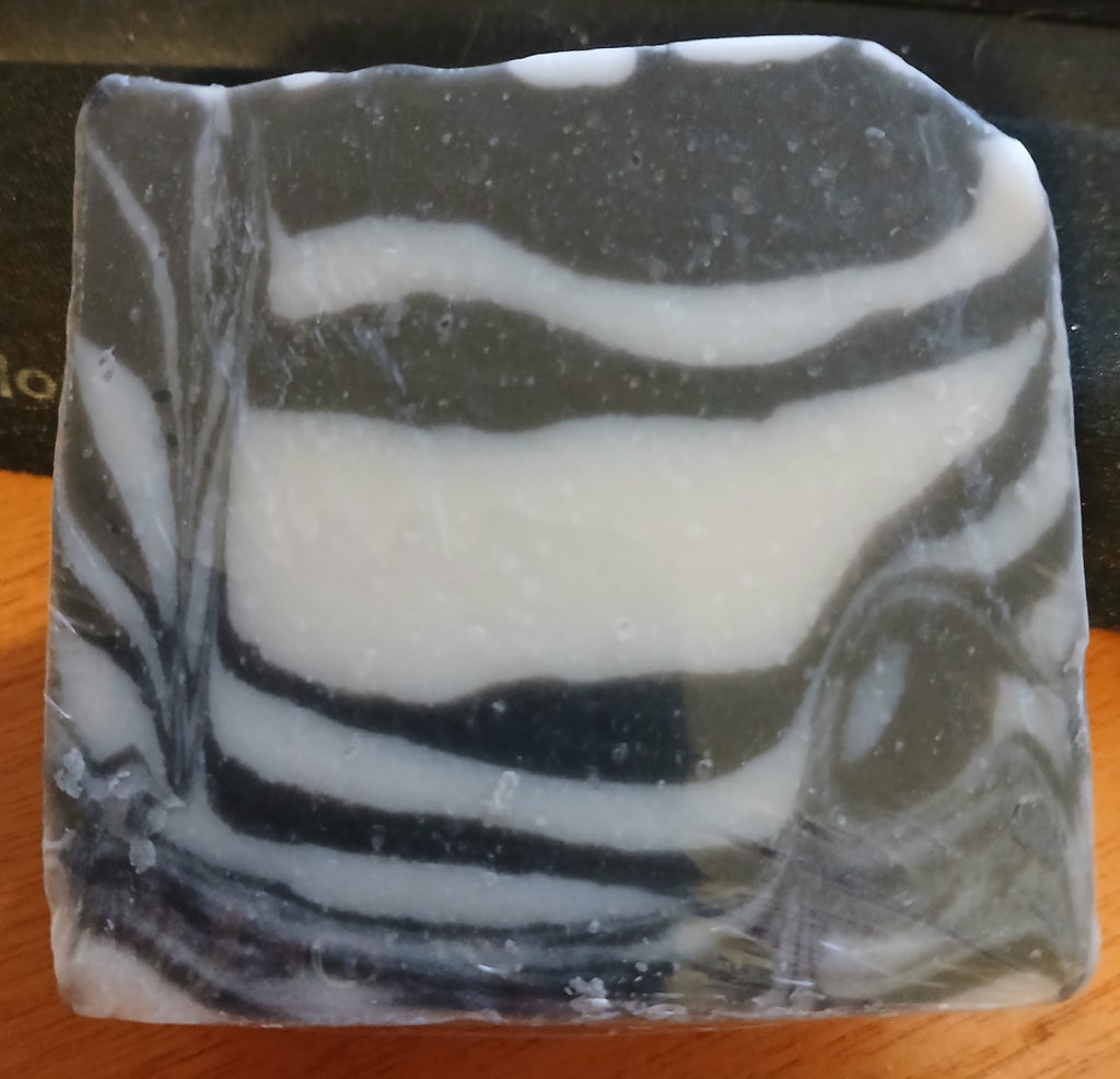 Ebony and Ivory cold process soap bar showing dramatic black and white swirls