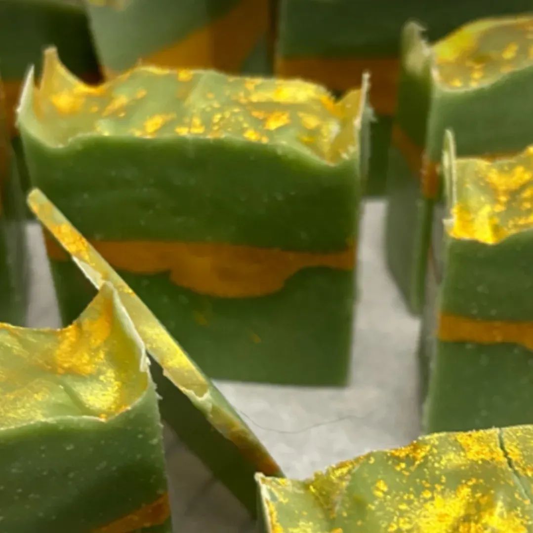 Lucky Day cold-process soap bars in deep green with gold mica dusting