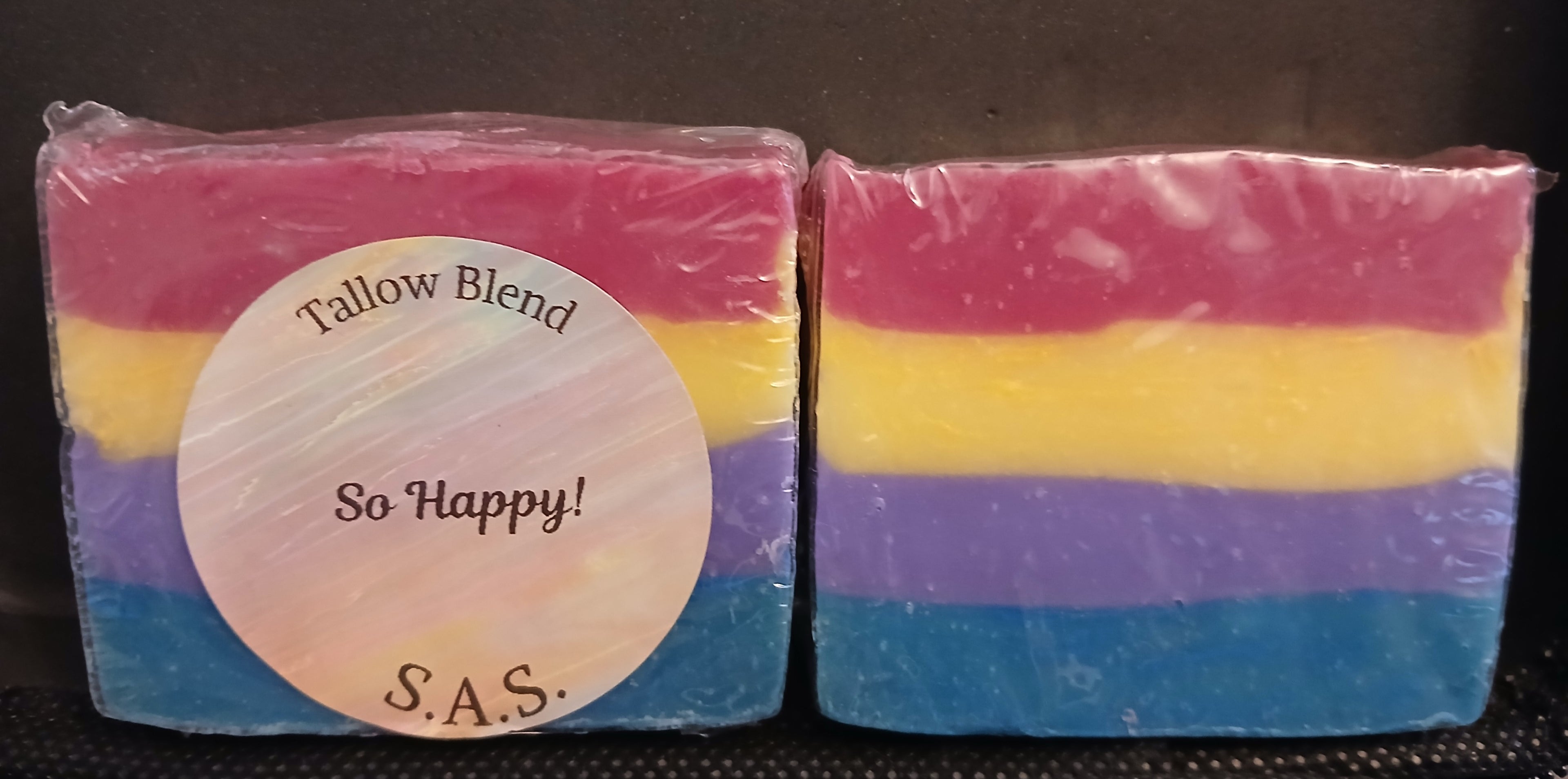 So Happy! colorful layered tallow blend soap bar in pink, yellow, lavender, and blue