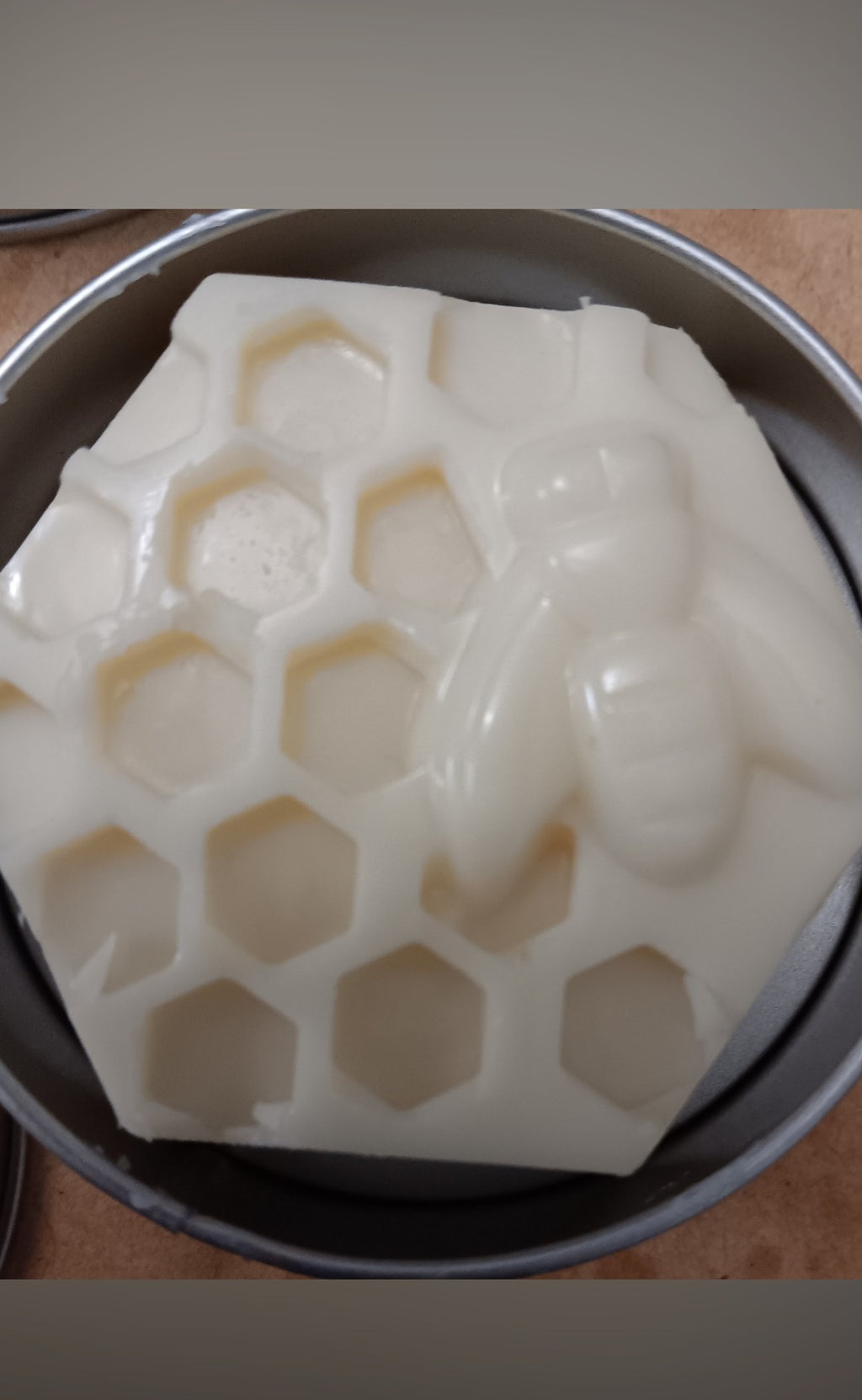Honeycomb lotion bar freshly poured in a hexagonal silicone mold with coconut oil, shea butter and beeswax