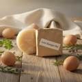 Luxe Shampoo Bar on a rustic farmhouse background with fresh eggs, herbs, and warm golden light
